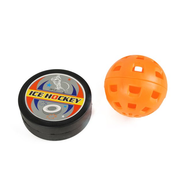 Hockey sticks with ball and puck